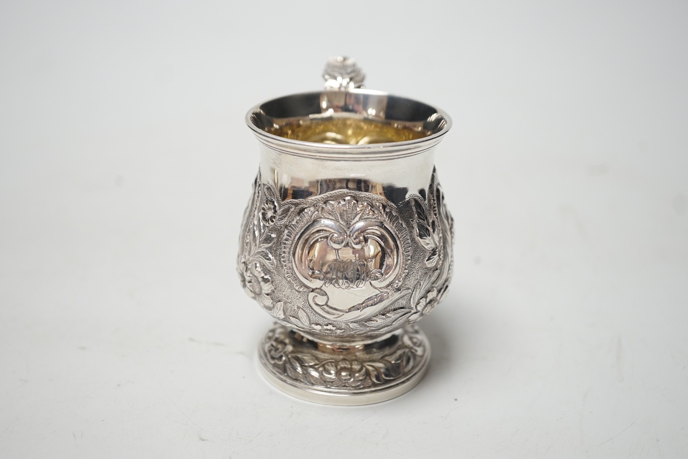 A George IV embossed silver baluster christening cup, London, 1828, 82mm, 3.4oz.